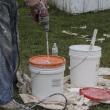 Tom Sawyer Day 2018 01 Jim Mixing the Whitewash Mud with Water